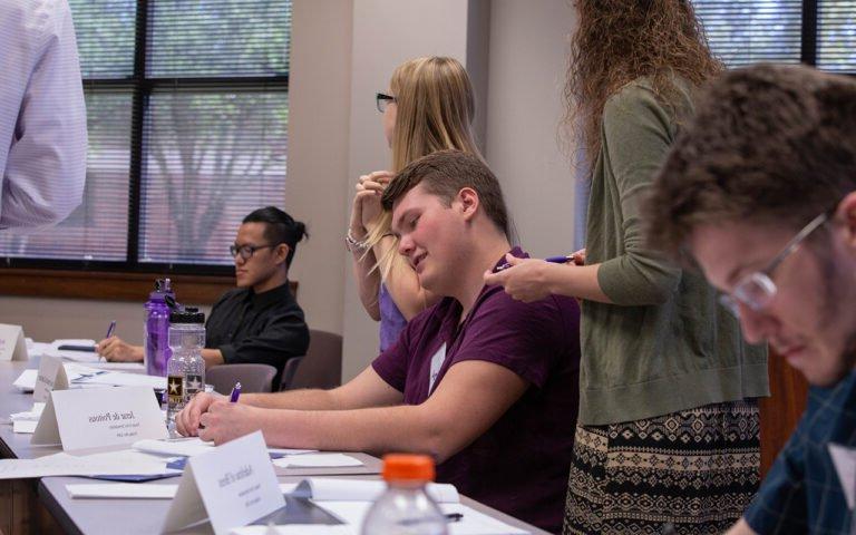 Photo of HSU students participating in Mock United Nations activities.